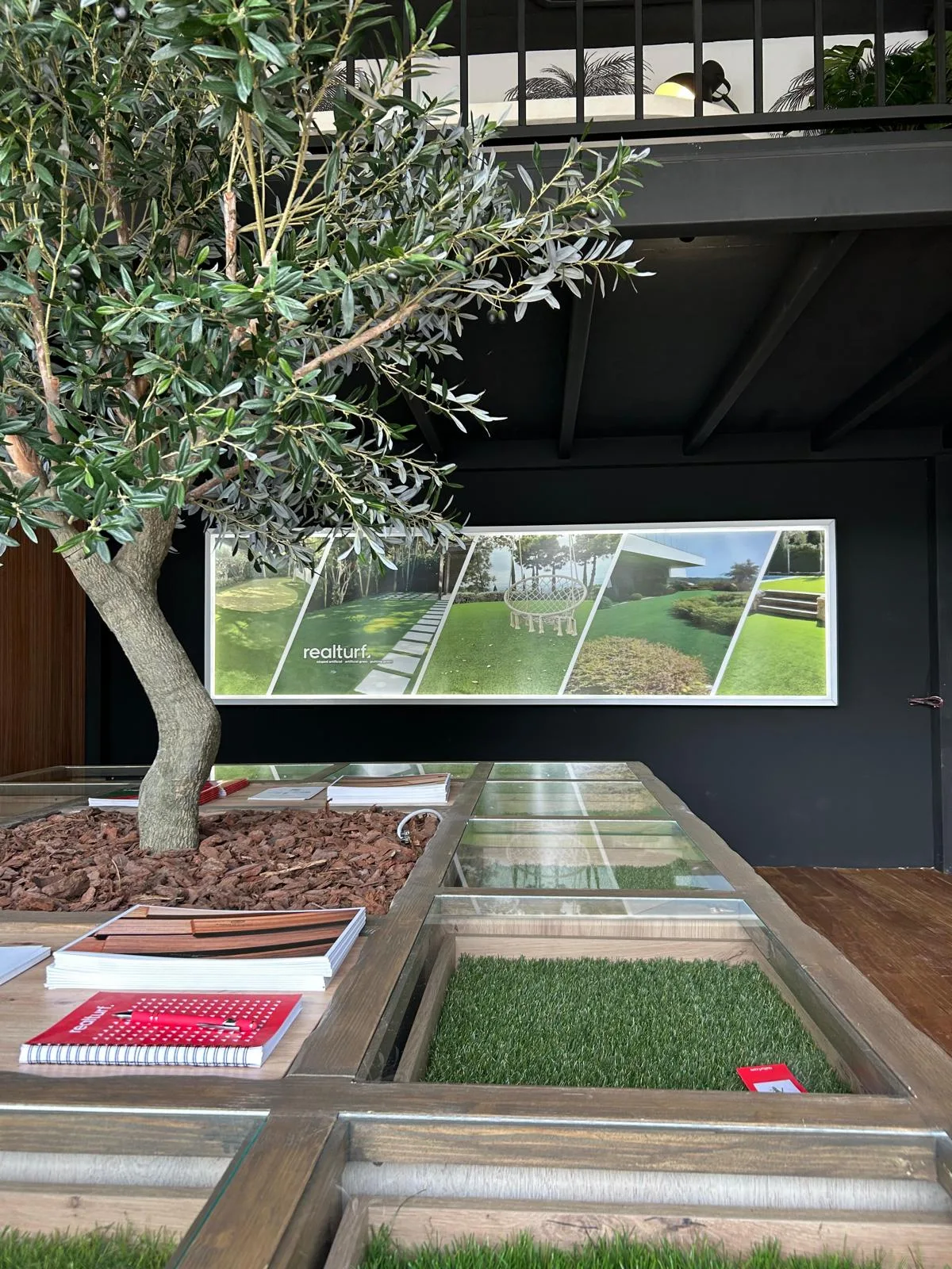 Grass samples under the glass floor at the SuperGrass Marbella showroom